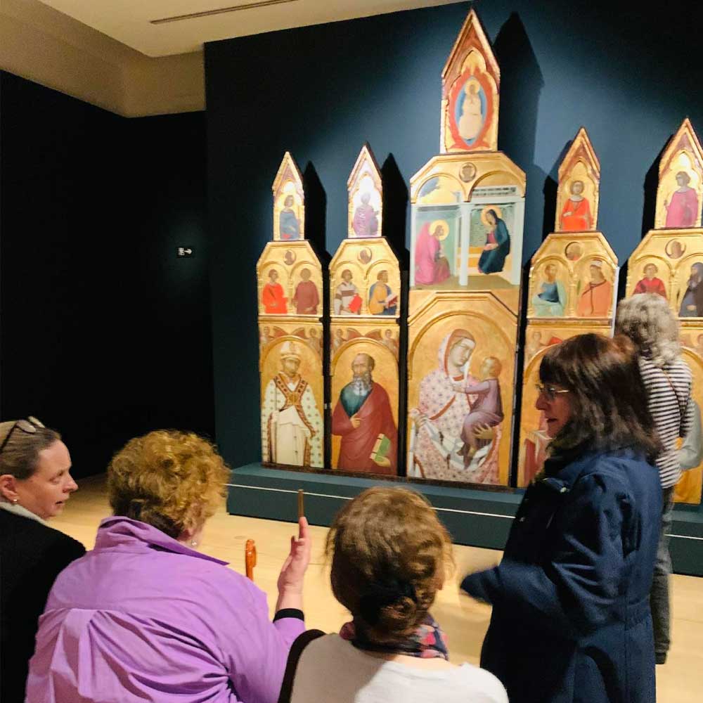 Learners viewing artworks in a gallery.