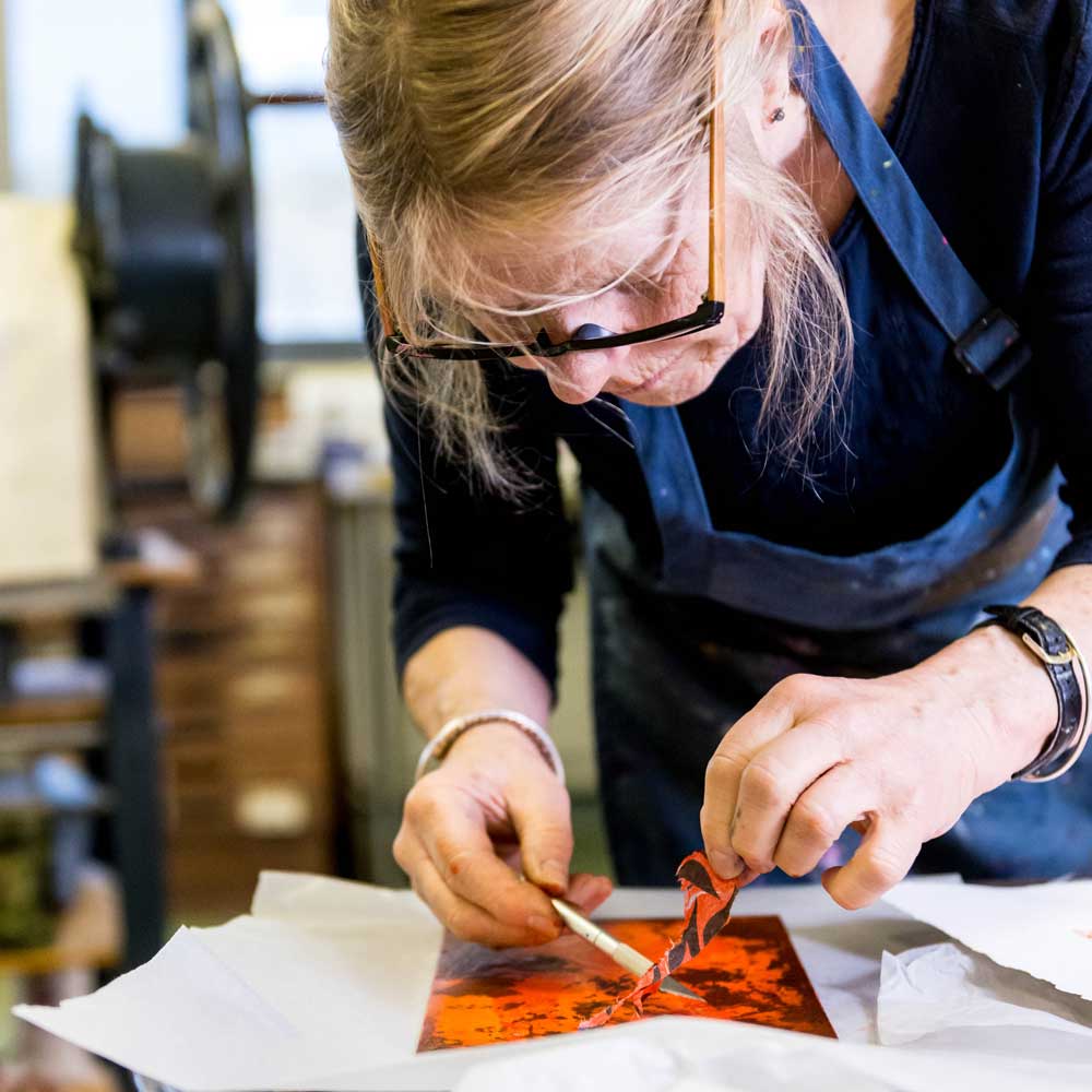 Learner carving a printing block.