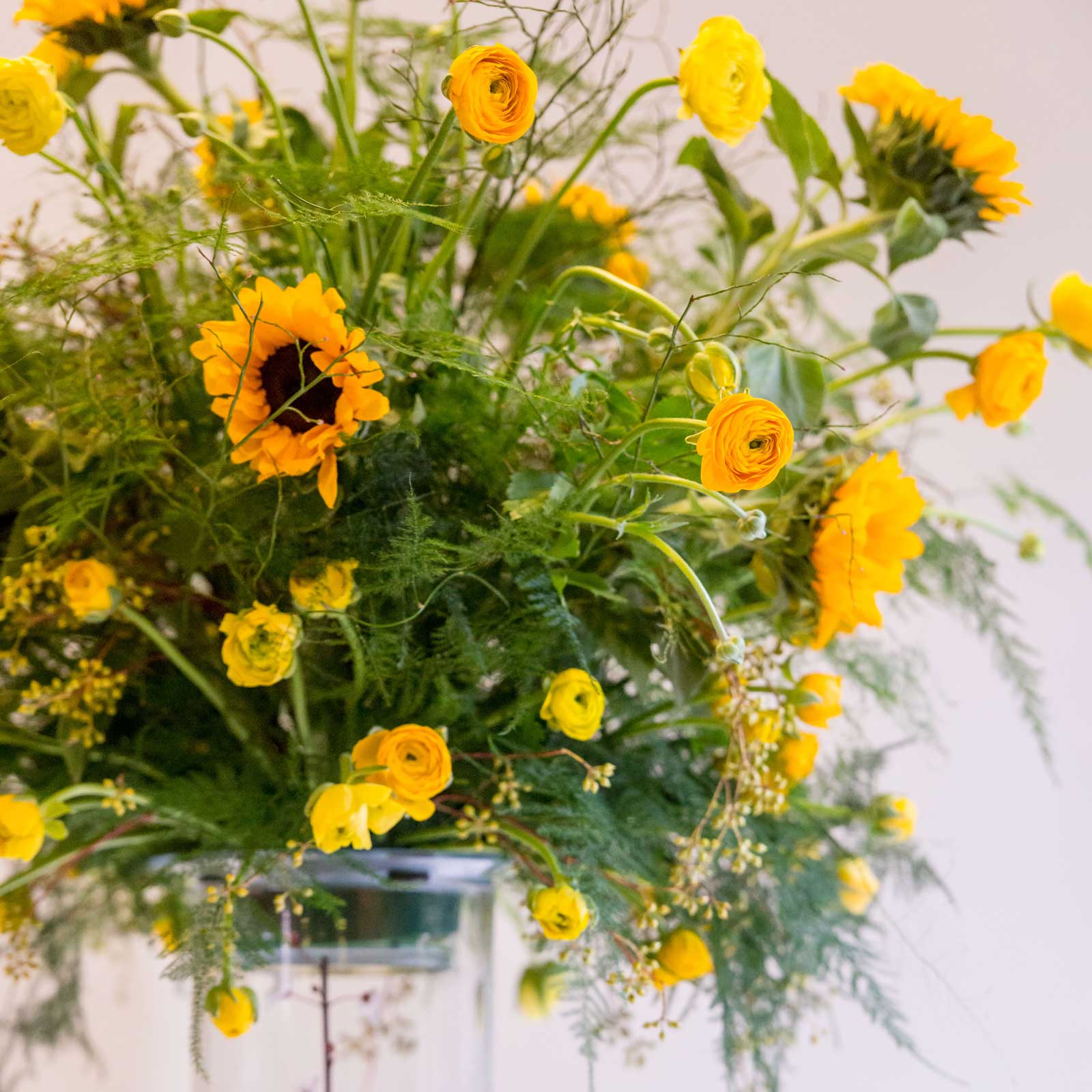 Yellow flowers in glass vase