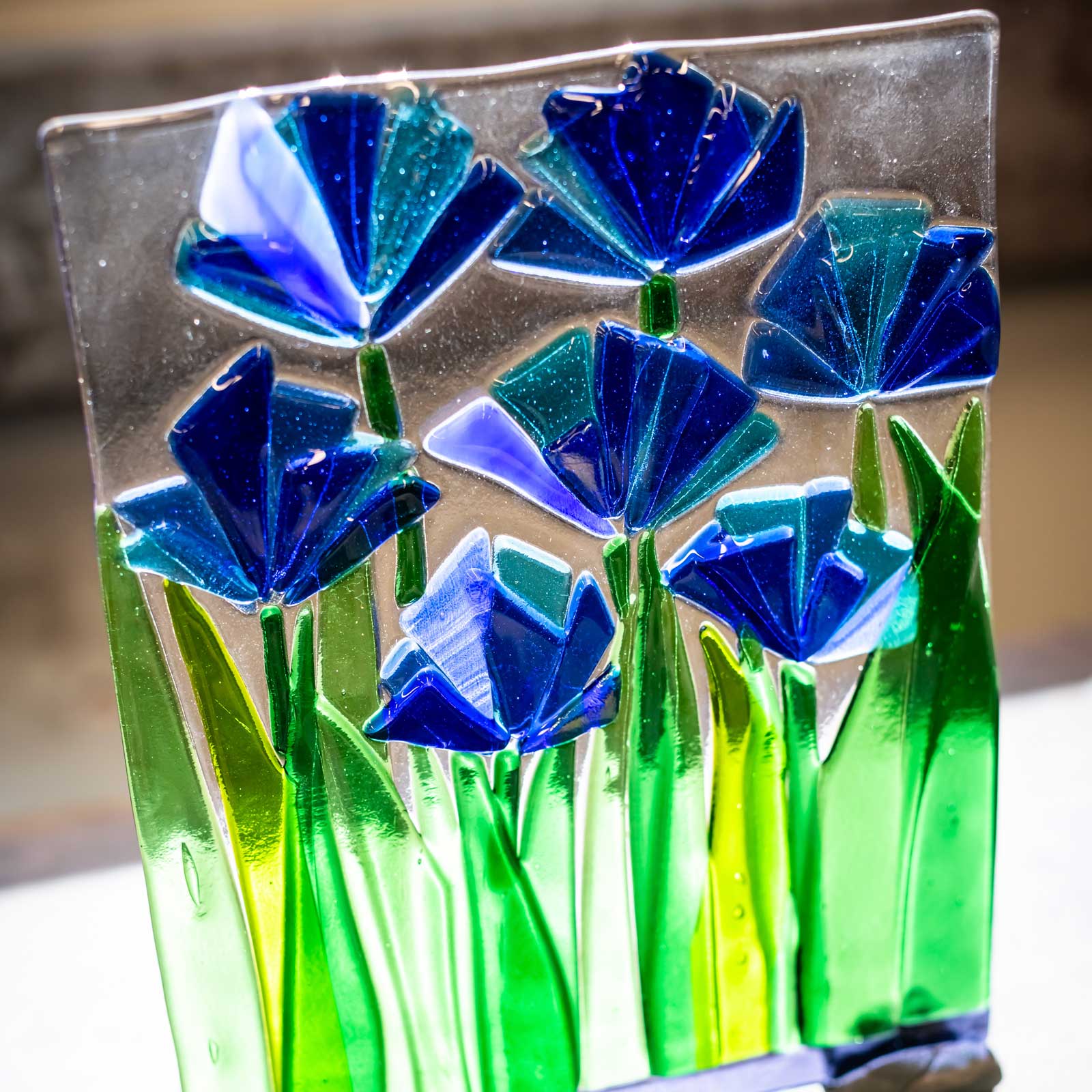 Glass sculpture of blue flowers