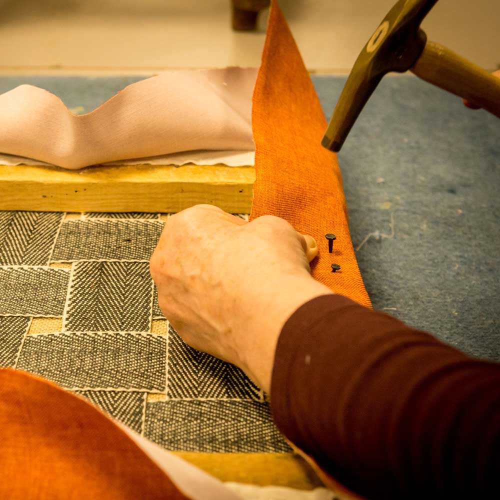Learner working on an upholstery project.