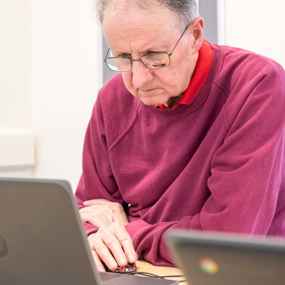 Learner practising digital skills on a laptop.