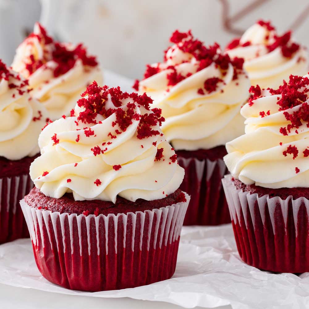 Decorated cupcakes on display.