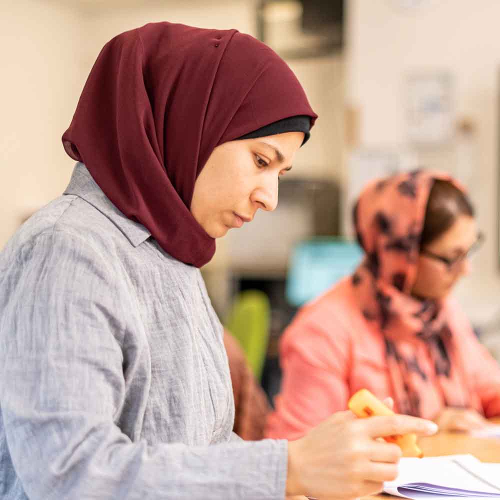 Learner studying in class.