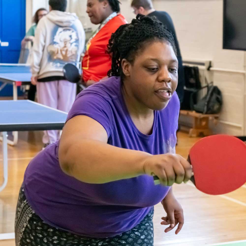Learner playing table tennis during a Health and wellbeing session.