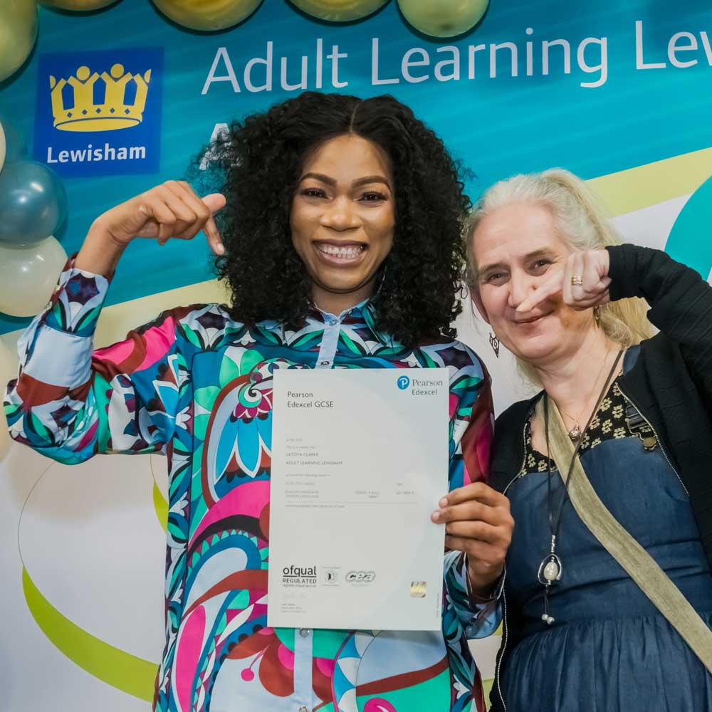 Learner holding an English GCSE certificate.
