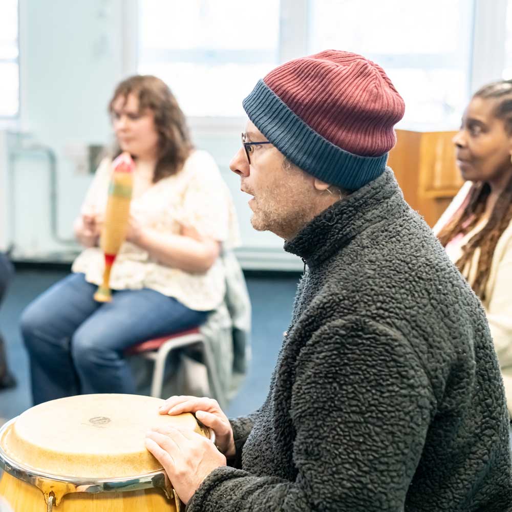 Group of learners playing percussive instruments.