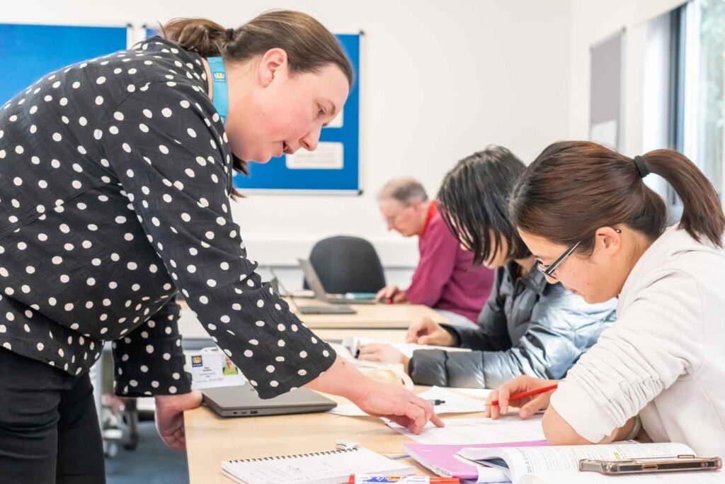 Tutor working with learner